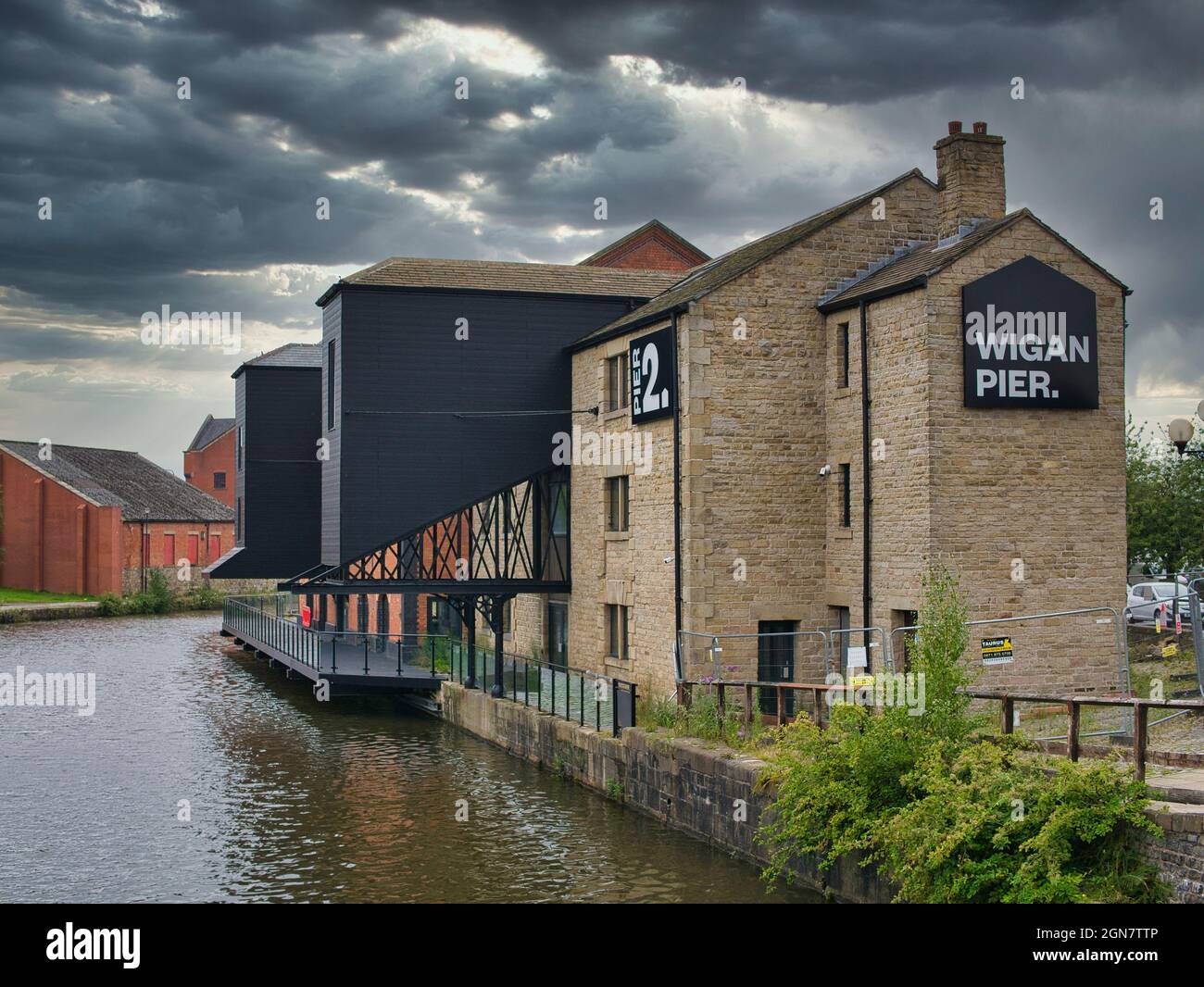 Warehouse buildings at Wigan Pier on the Leeds - Liverpool Canal. Now under redevelopment for housing and public access areas. Stock Photo