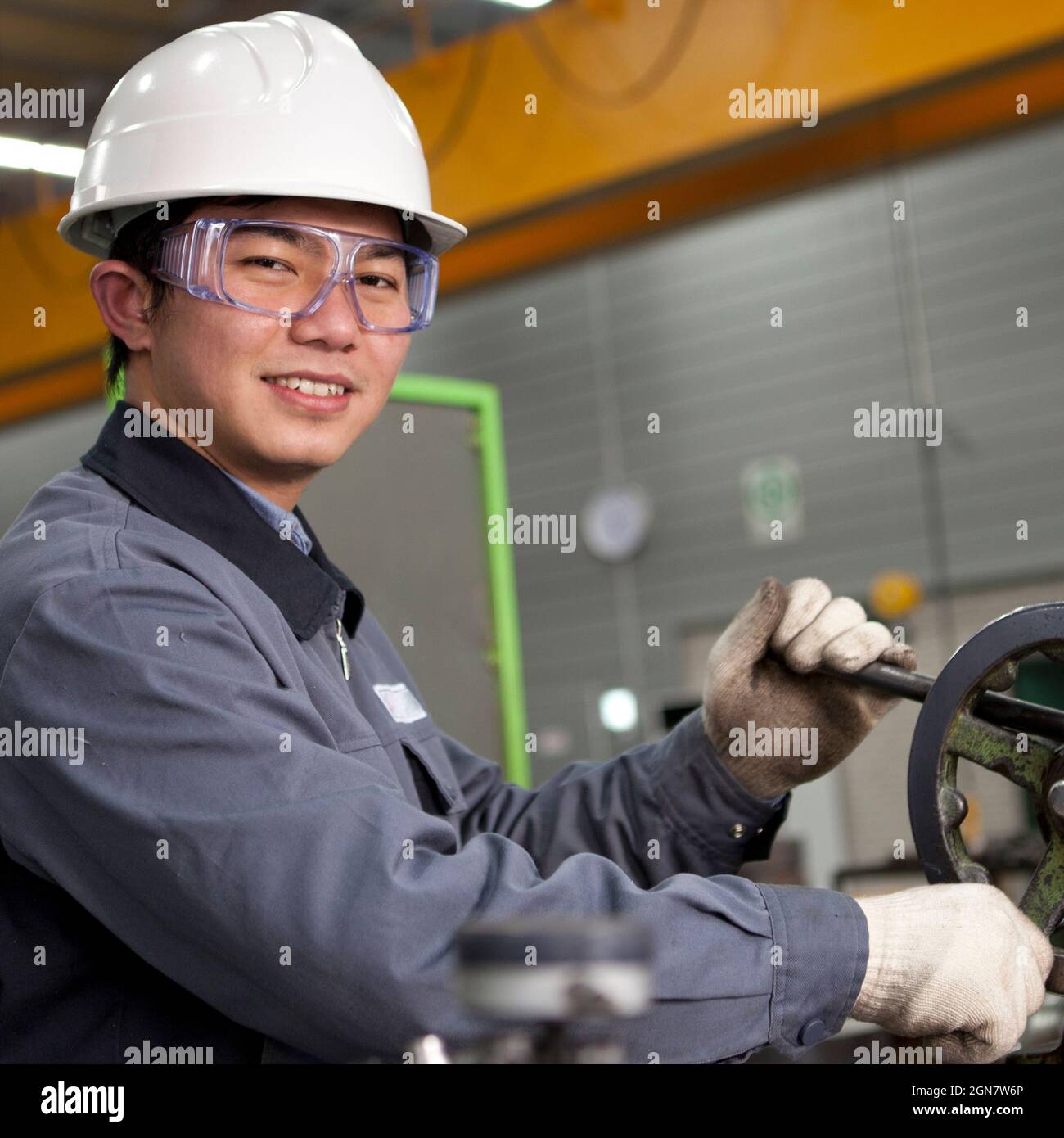 Modern industrial machine operator working in factory Stock Photo Alamy