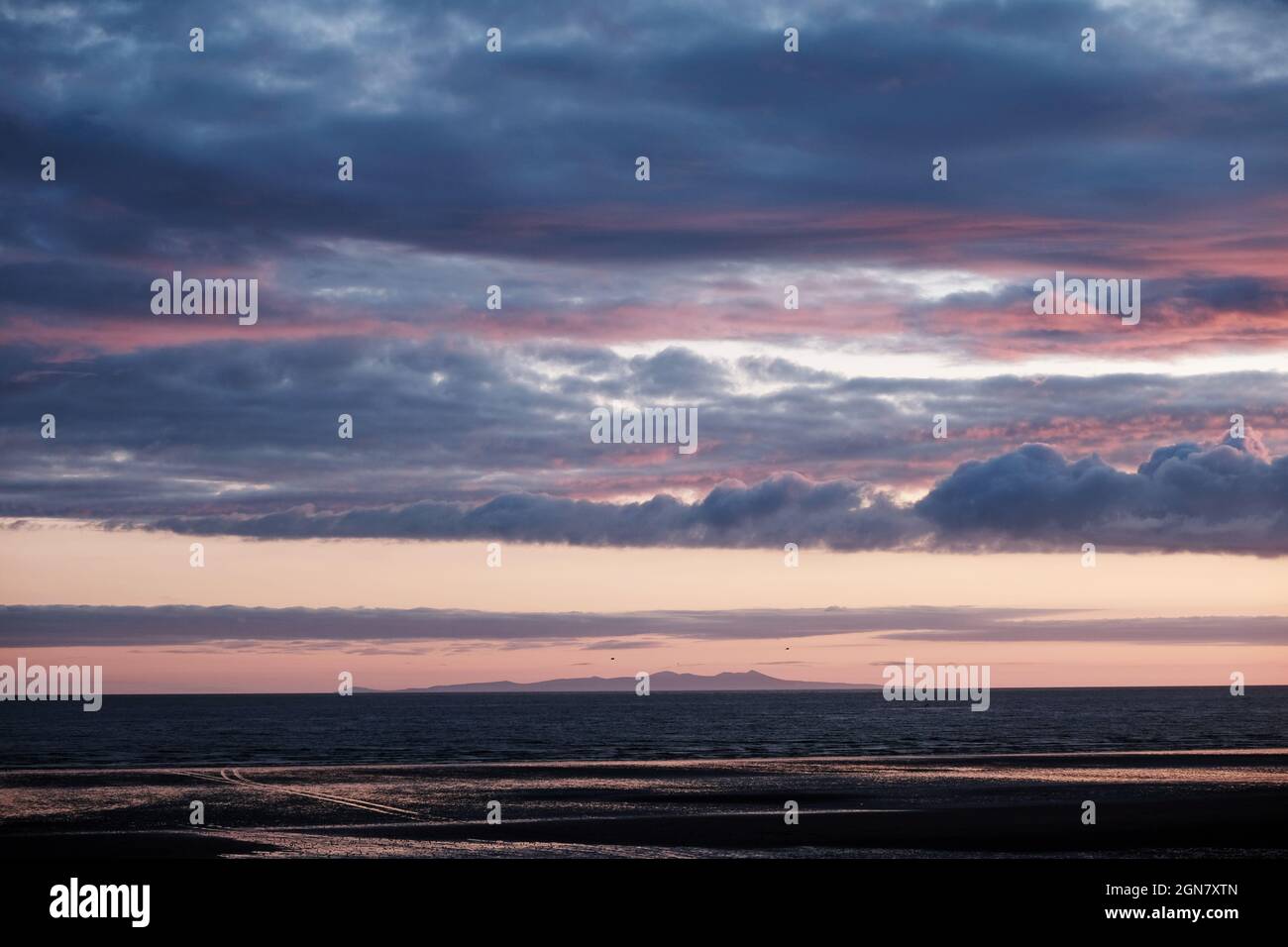 The Isle of Man from Seascale (Cumbria) at Sunset Stock Photo