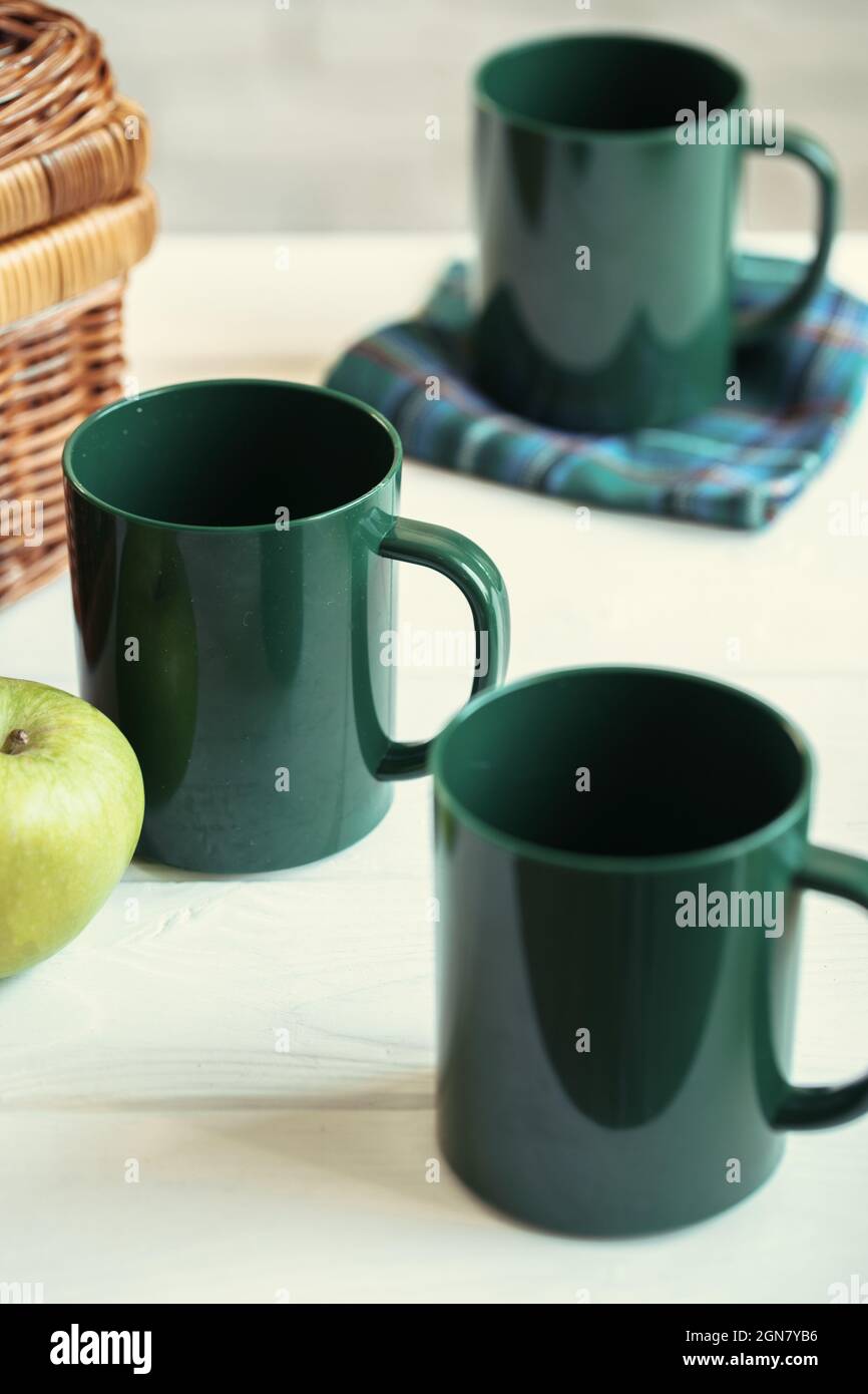 Green plastic kitchenware on a table close up Stock Photo