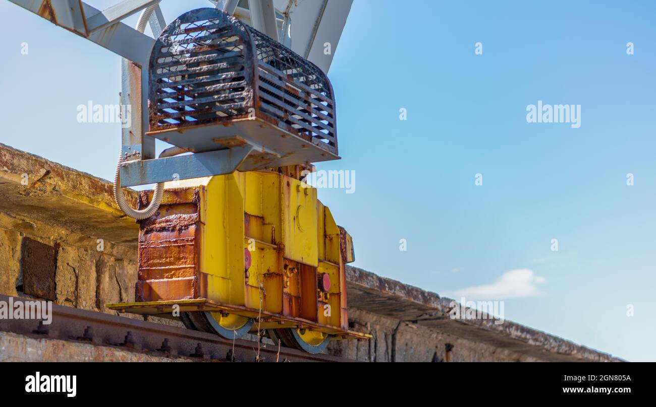 Railway crane wheel on rail Stock Photo