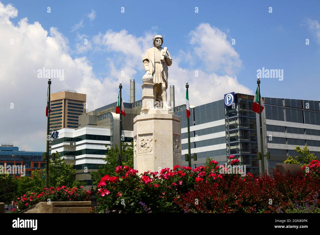 Statue of Christopher Columbus in Columbus Park, World Trade Centre building in left background, Inner Harbor, Baltimore, Maryland, USA Stock Photo