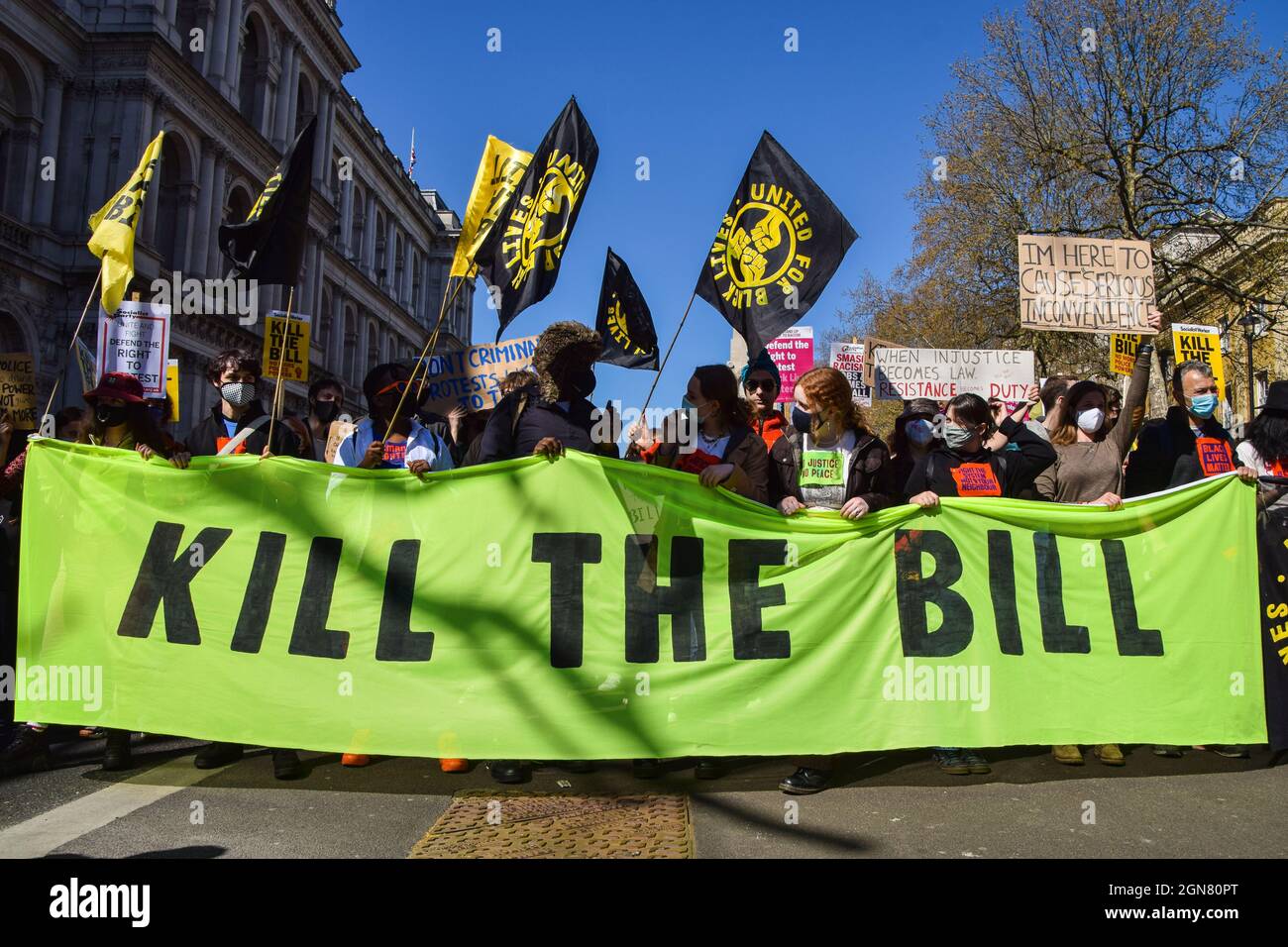 Demonstrators hold a Kill The Bill banner in Whitehall. Crowds marched through Central London in protest of the Police, Crime, Sentencing and Courts Bill. London, United Kingdom. 17th April 2021. Stock Photo