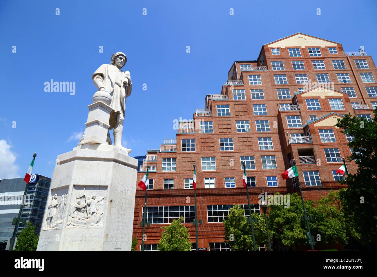 Statue of Christopher Columbus in Columbus Park and Scarlett Place Residential Condominiums building, Inner Harbor, Baltimore, Maryland, USA Stock Photo