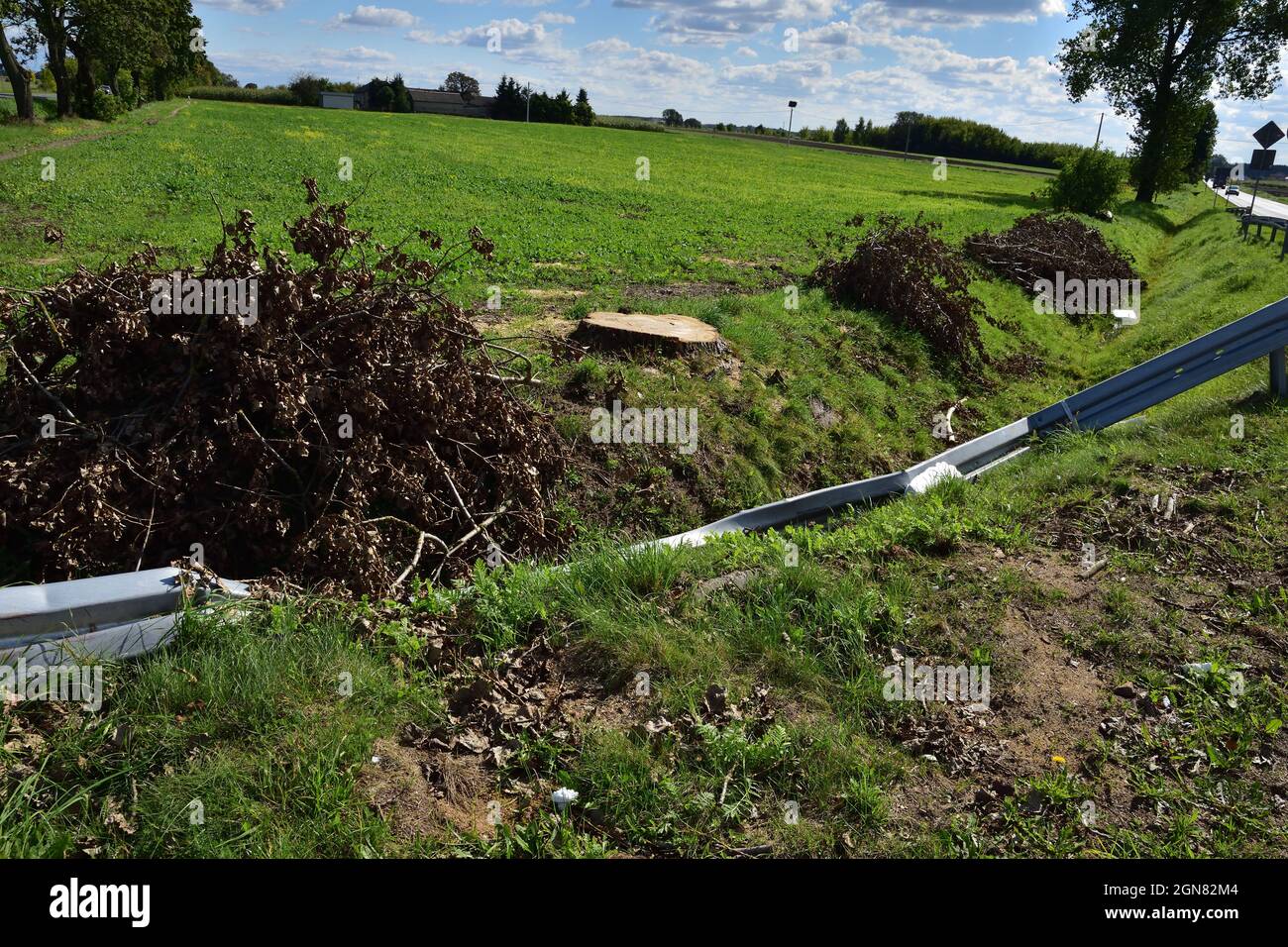 Damaged energy-consuming barrier by the road during an accident. Danger. Stock Photo