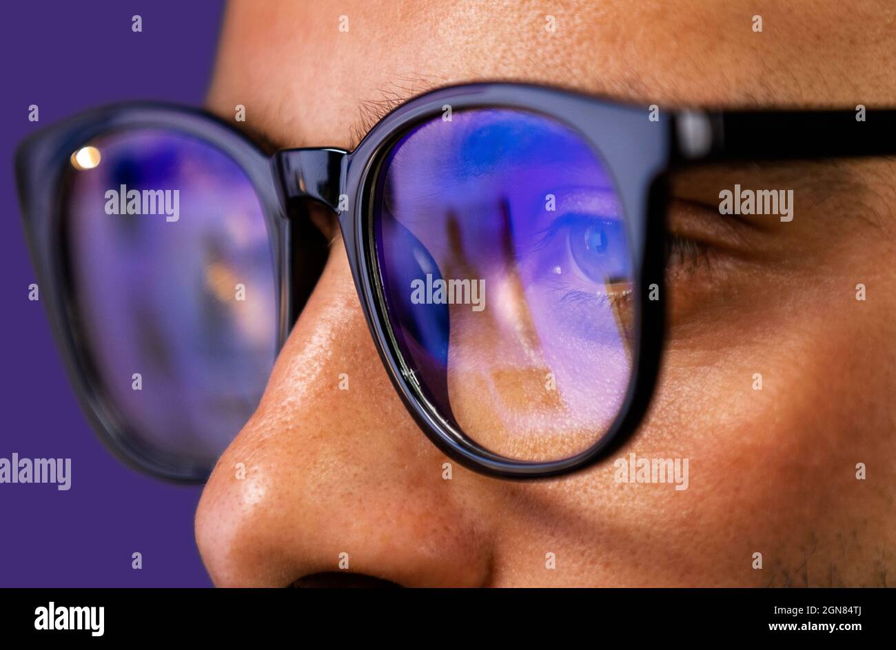 Close up view of focused businessman reading, watching, working online