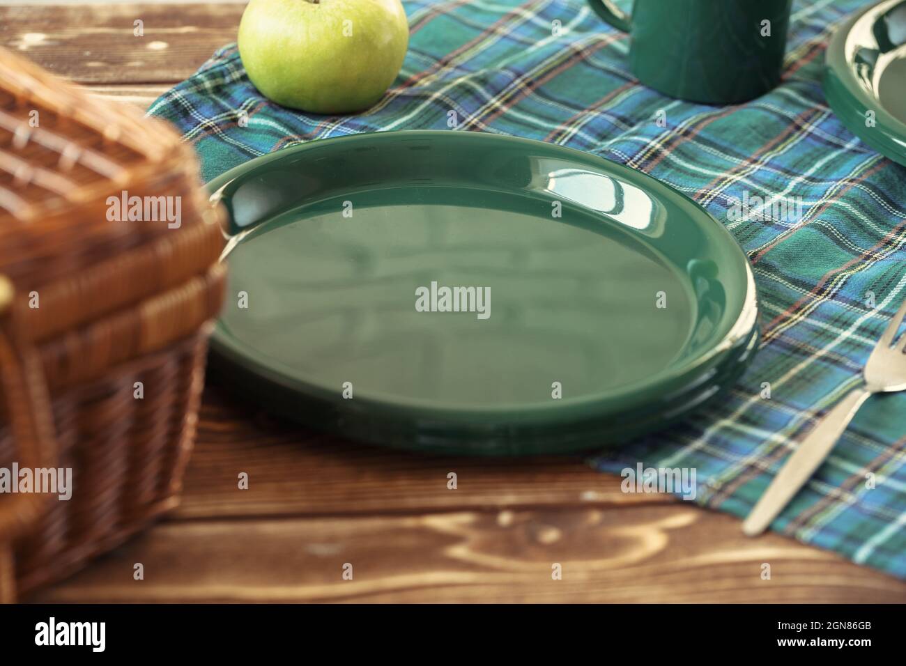 Green plastic kitchenware on a table close up Stock Photo