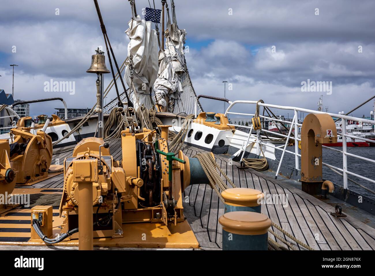 REYKJAVIK, ICELAND - June 11, 2021: Front deck, bow, anchor winches and folded sails of American coastguard tallship Eagle, visiting Reykjavik Harbour. Stock Photo