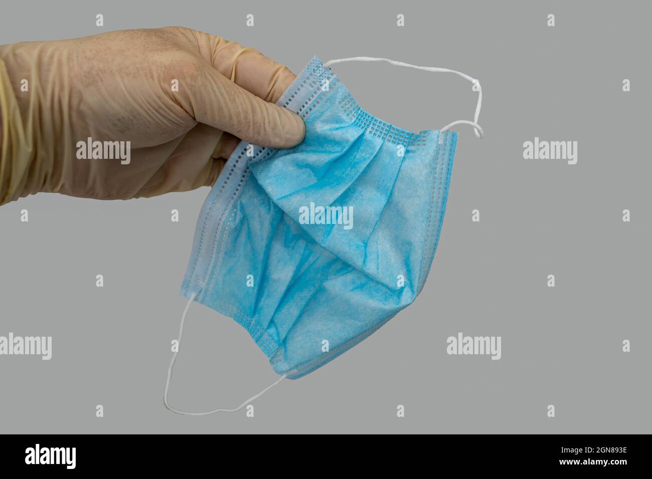 contaminated used standard medical disposable face mask having been ...