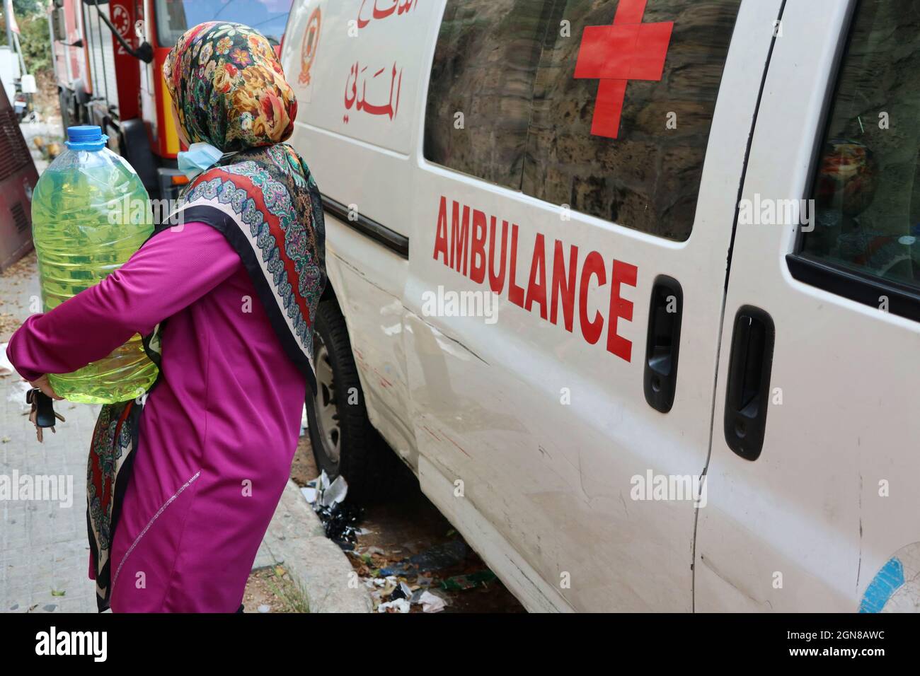 Beirut, Lebanon. 23rd Sep, 2021. A woman leaves a gas station after
