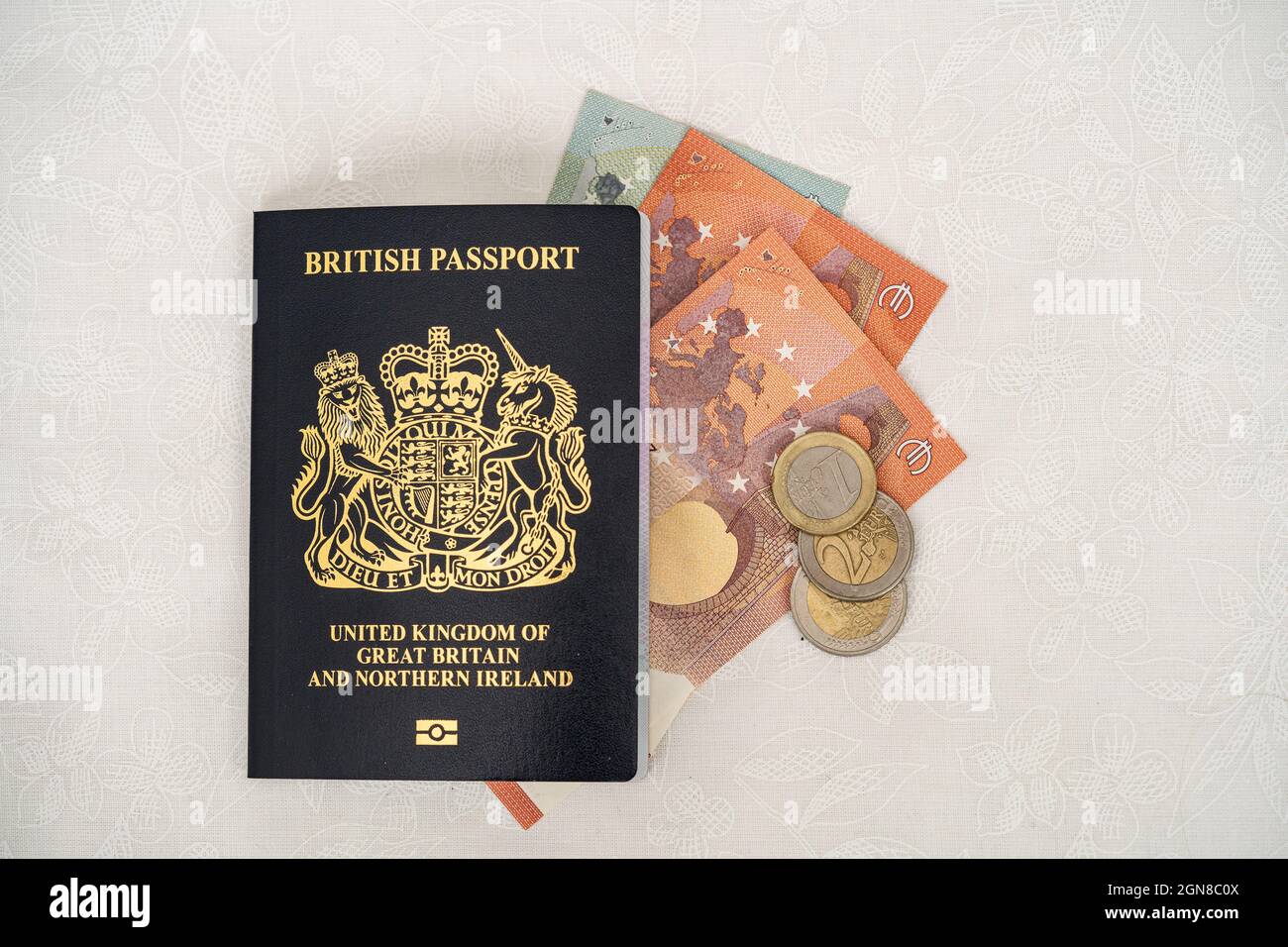 Post Brexit British Passport United Kingdom of Great Britain and Northern Ireland with euro notes and coins Stock Photo