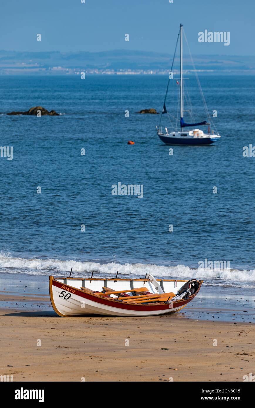 Coastal rowing club St Ayle's skiff wooden boat on beach, North Berwick, East Lothian, Scotland, UK Stock Photo