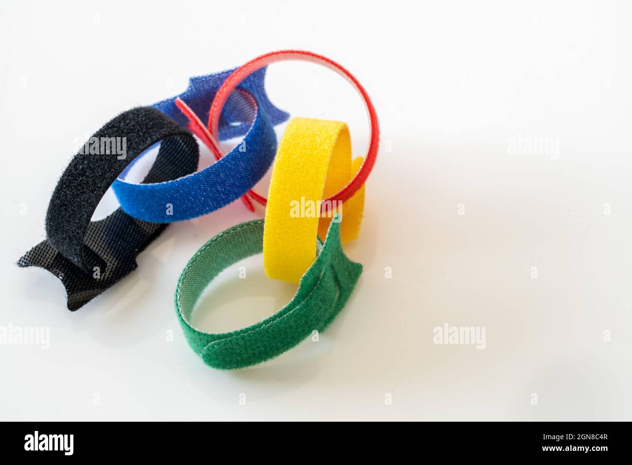 selection of five primary colored velcro hook and loop fastner ties joined together Stock Photo