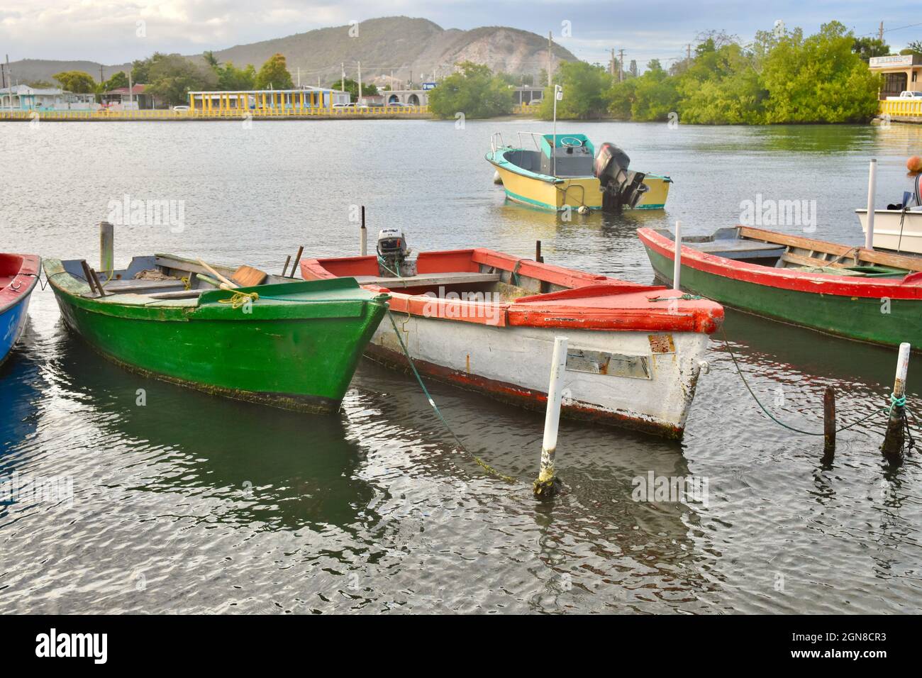 Colorful fishing boats tied up in the harbor in Guanica, Puerto Rico. Stock Photo