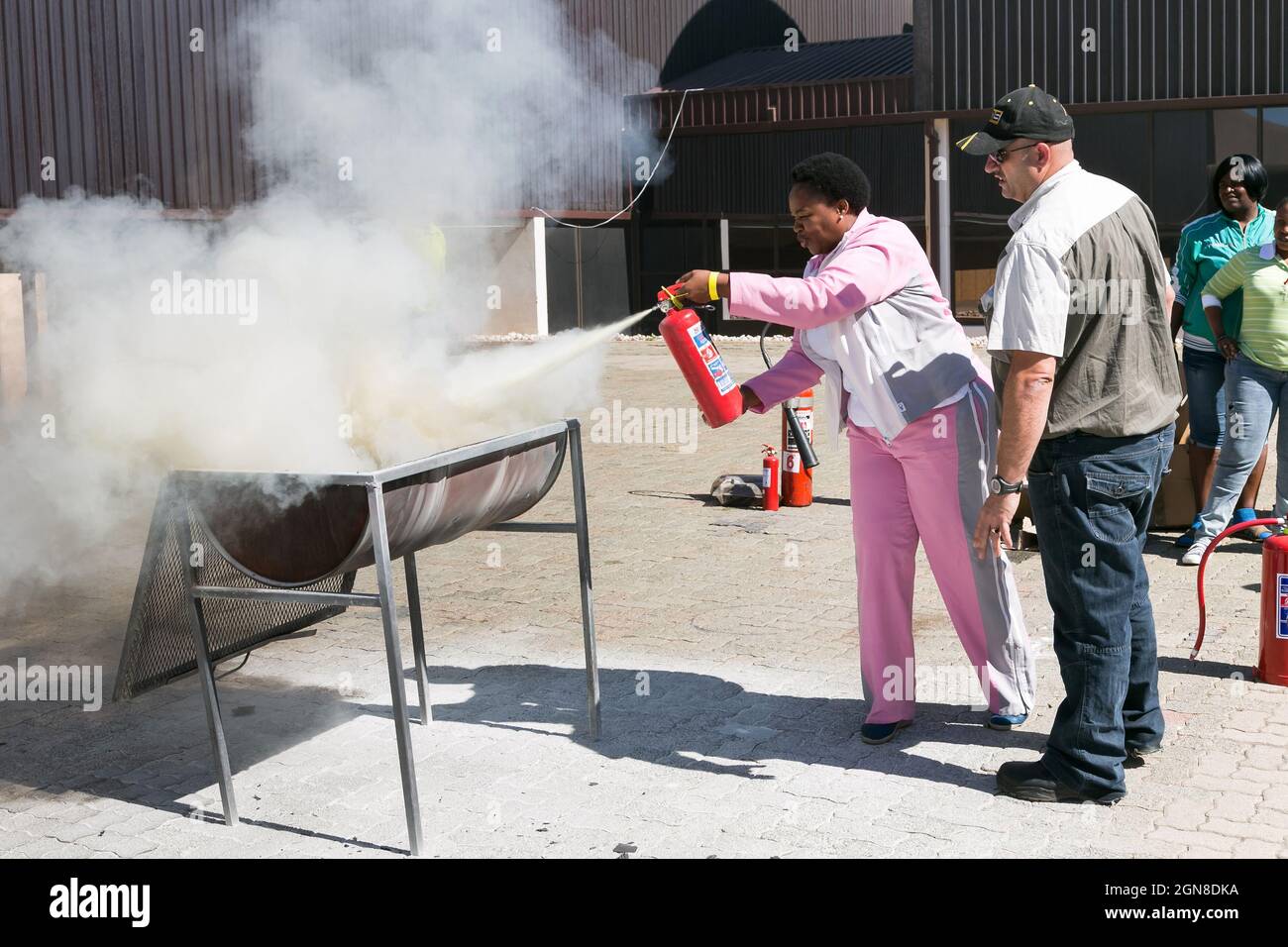 JOHANNESBURG, SOUTH AFRICA - Aug 12, 2021: The Fire hazard training with a powder-based extinguisher Stock Photo