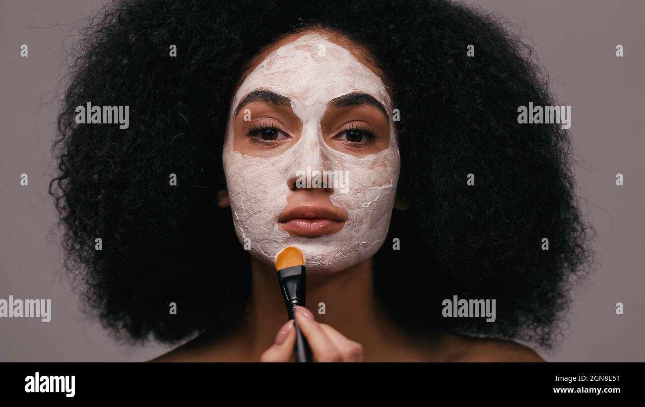 Applying black mask on face hi-res stock photography and images - Alamy