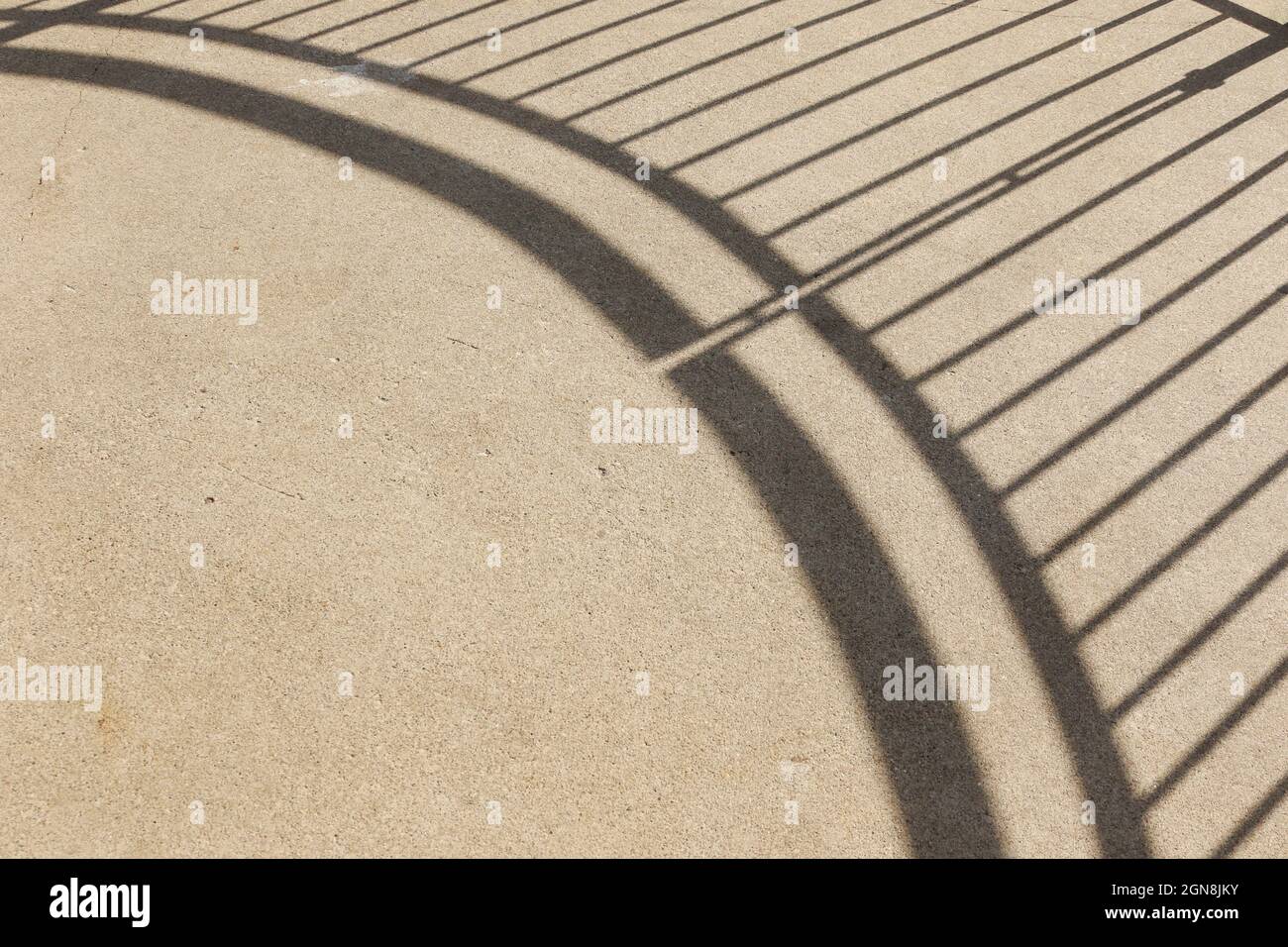Abstract shadow from handrail showing on concrete. Grandad Bluff Park, La Crosse, Wisconsin, USA. Stock Photo