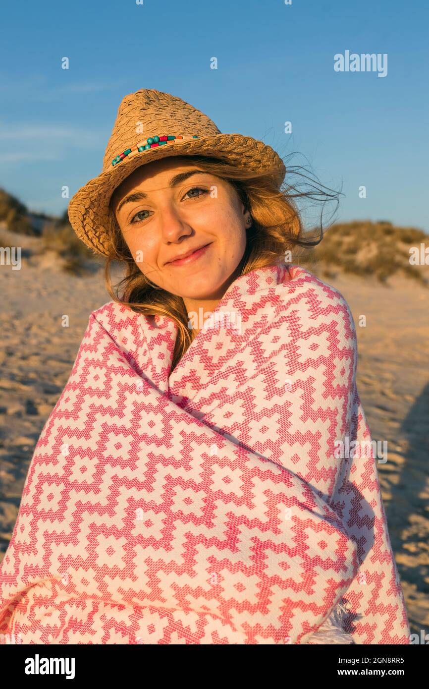 Woman on beach wearing a hat hi-res stock photography and images - Alamy