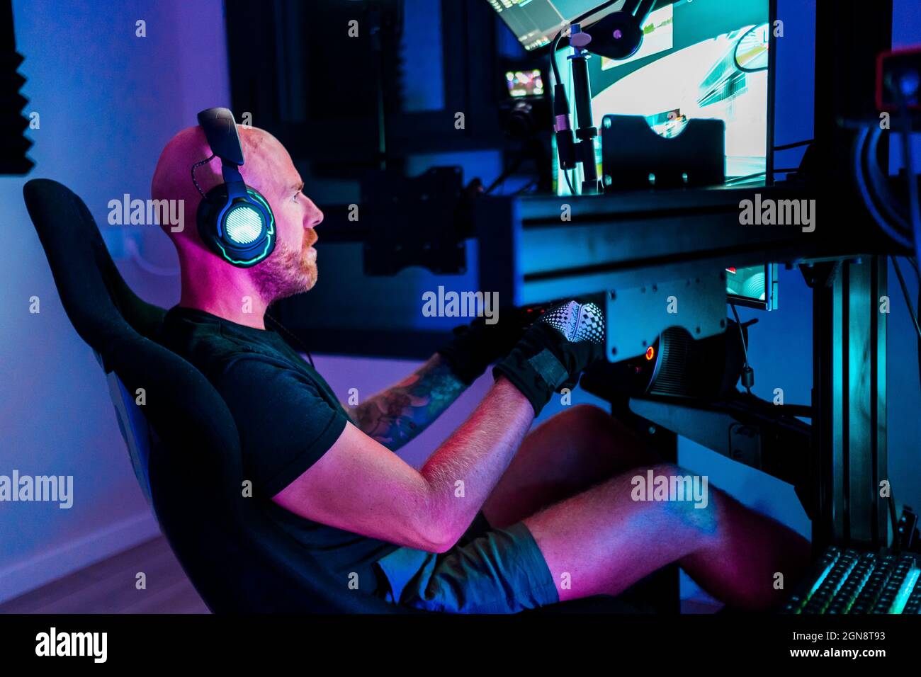 Bald man playing game at studio Stock Photo