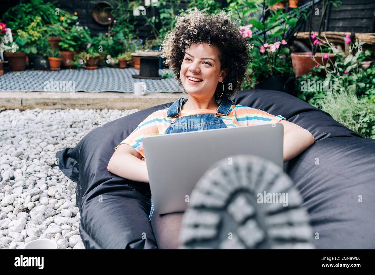Woman Sitting On Bean Bag High Resolution Stock Photography and Images ...