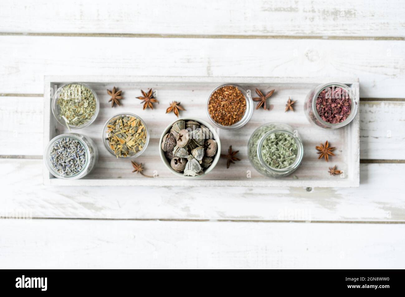 Spices and herbs arranged in serving tray over table Stock Photo