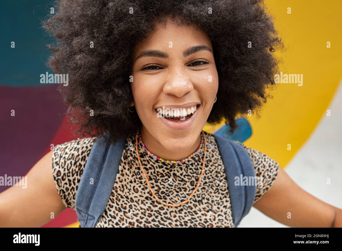 Cheerful young woman with black Afro hairstyle Stock Photo