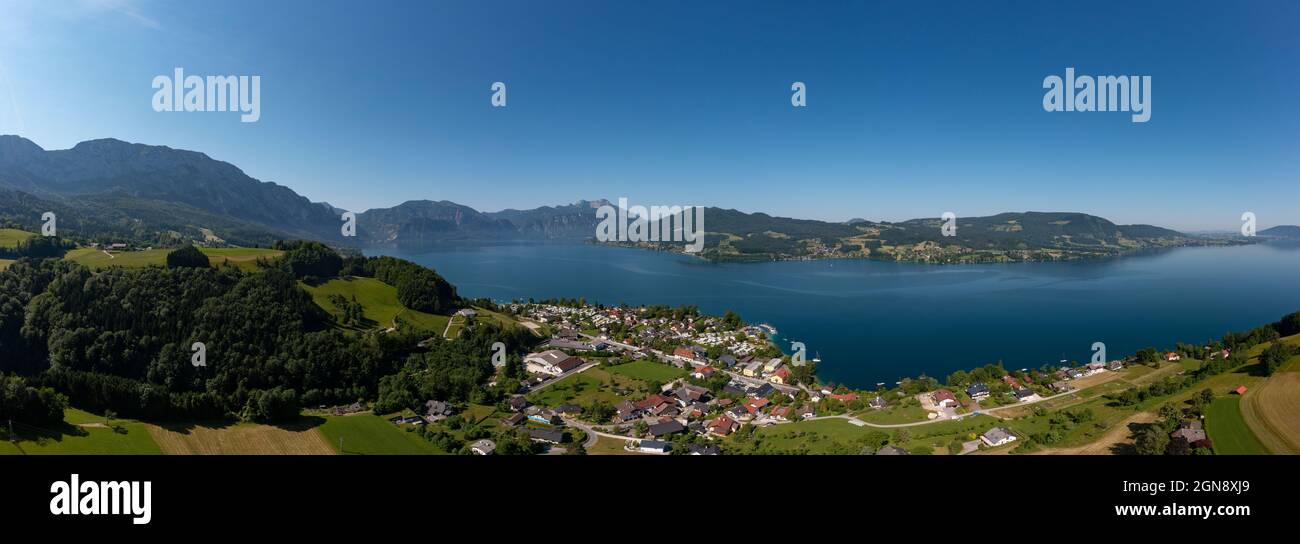 Austria, Upper Austria, Steinbach am Attersee, Drone panorama of small town on shore of Lake Atter Stock Photo
