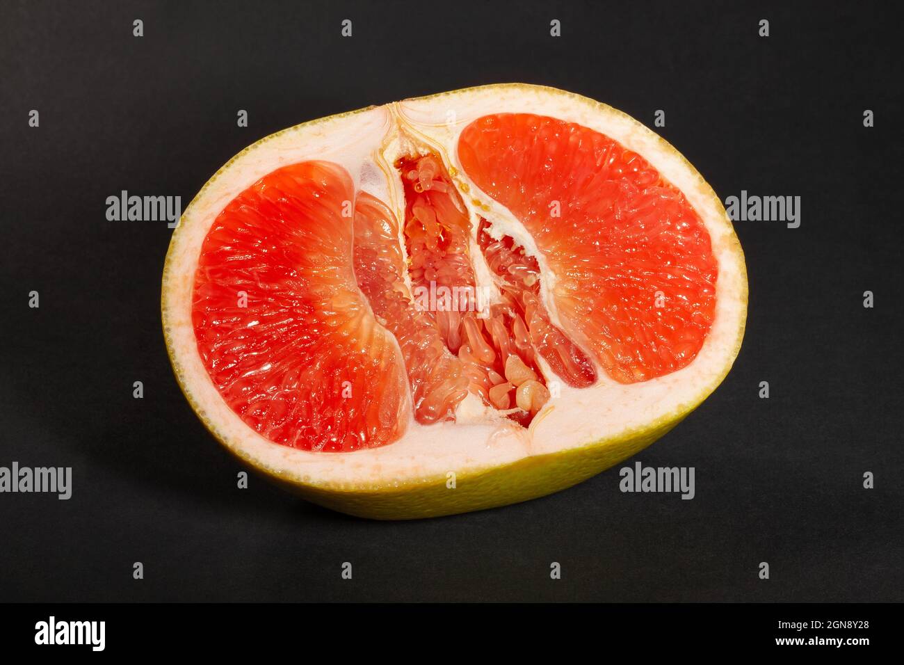 sliced yellow grapefruit on black background Stock Photo
