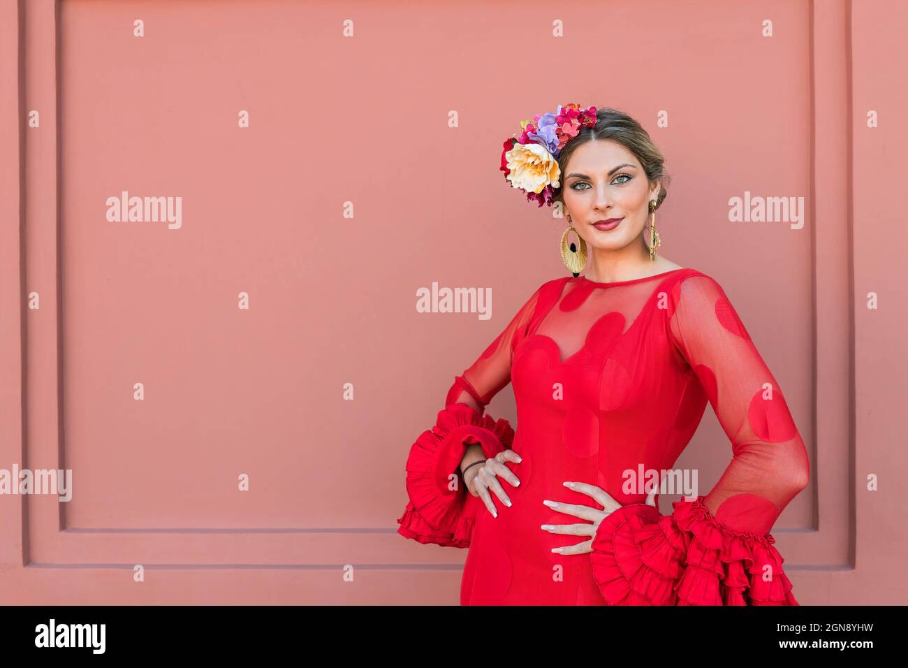 Women in red dress hands on hip hi-res stock photography and images - Alamy