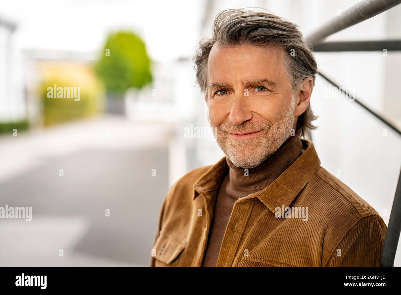 Handsome mature man standing hi-res stock photography and images - Alamy