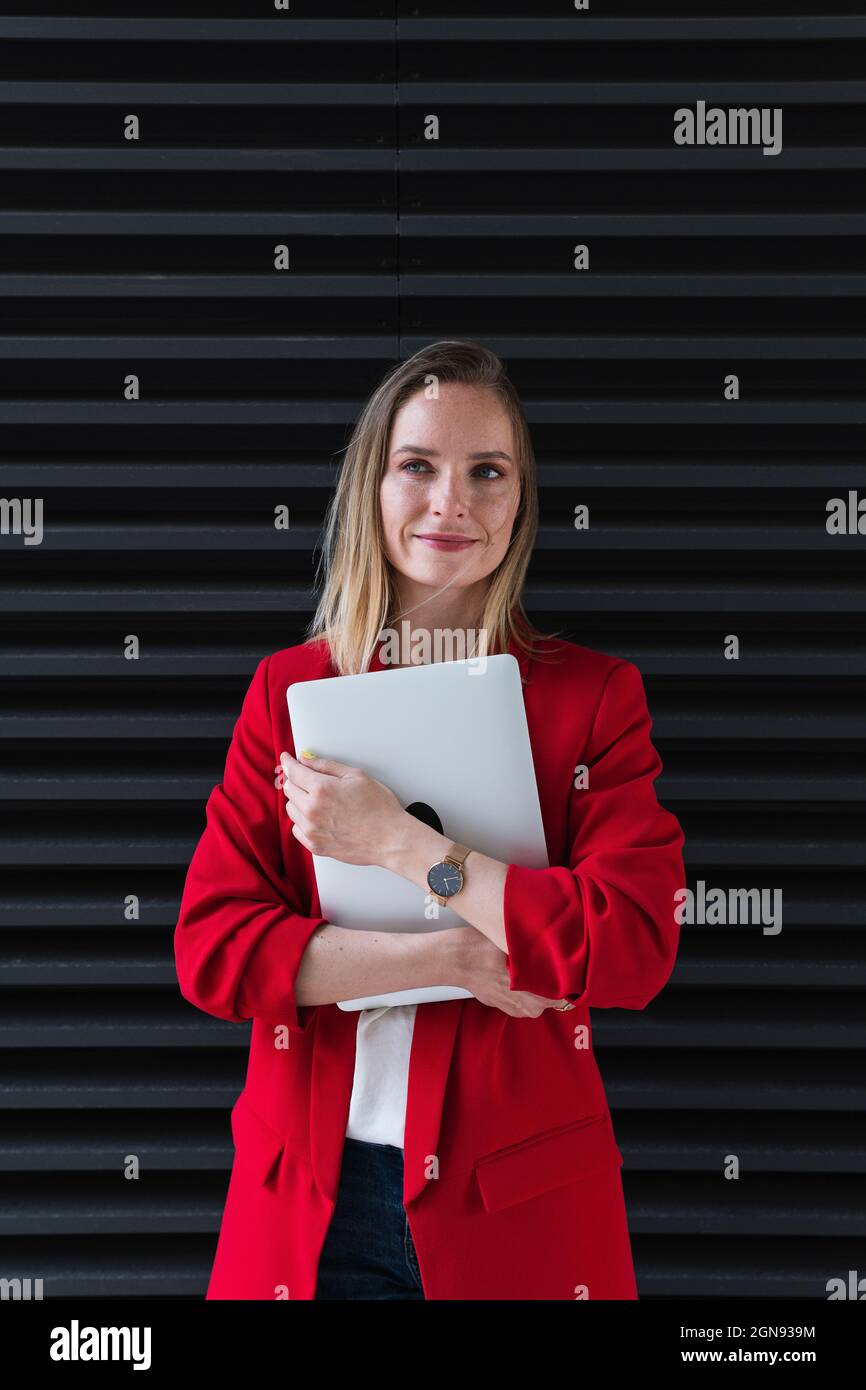 Businesswoman in black blazer hi-res stock photography and images - Alamy