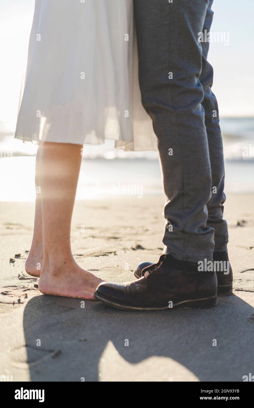 Couple standing together beach hi-res stock photography and images - Alamy