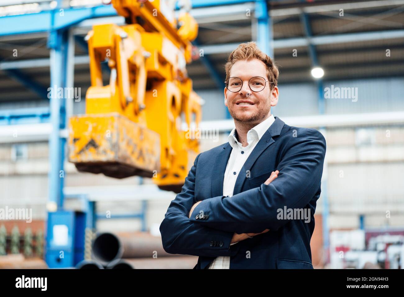 Male manager using digital tablet while standing by truck Stock Photo