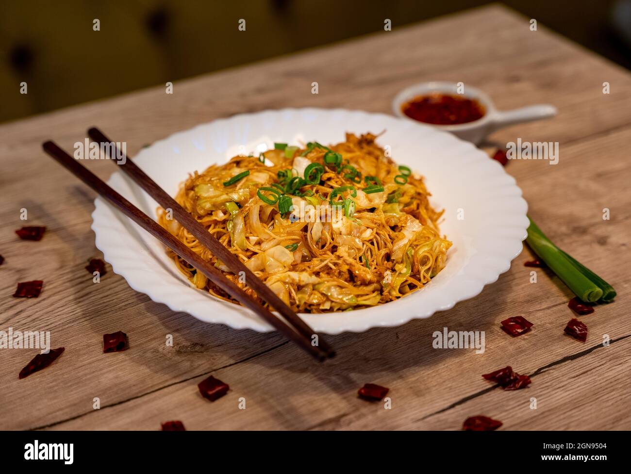 Fried rice noodles with vegetables and chili sauce Stock Photo Alamy