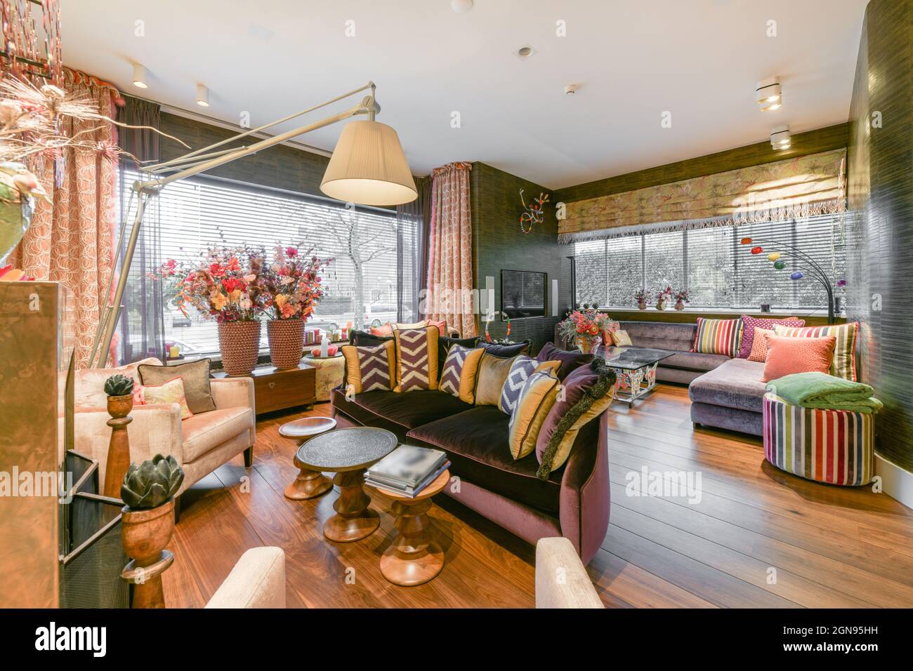 Bright and colorful living room with sofas and plants Stock Photo - Alamy