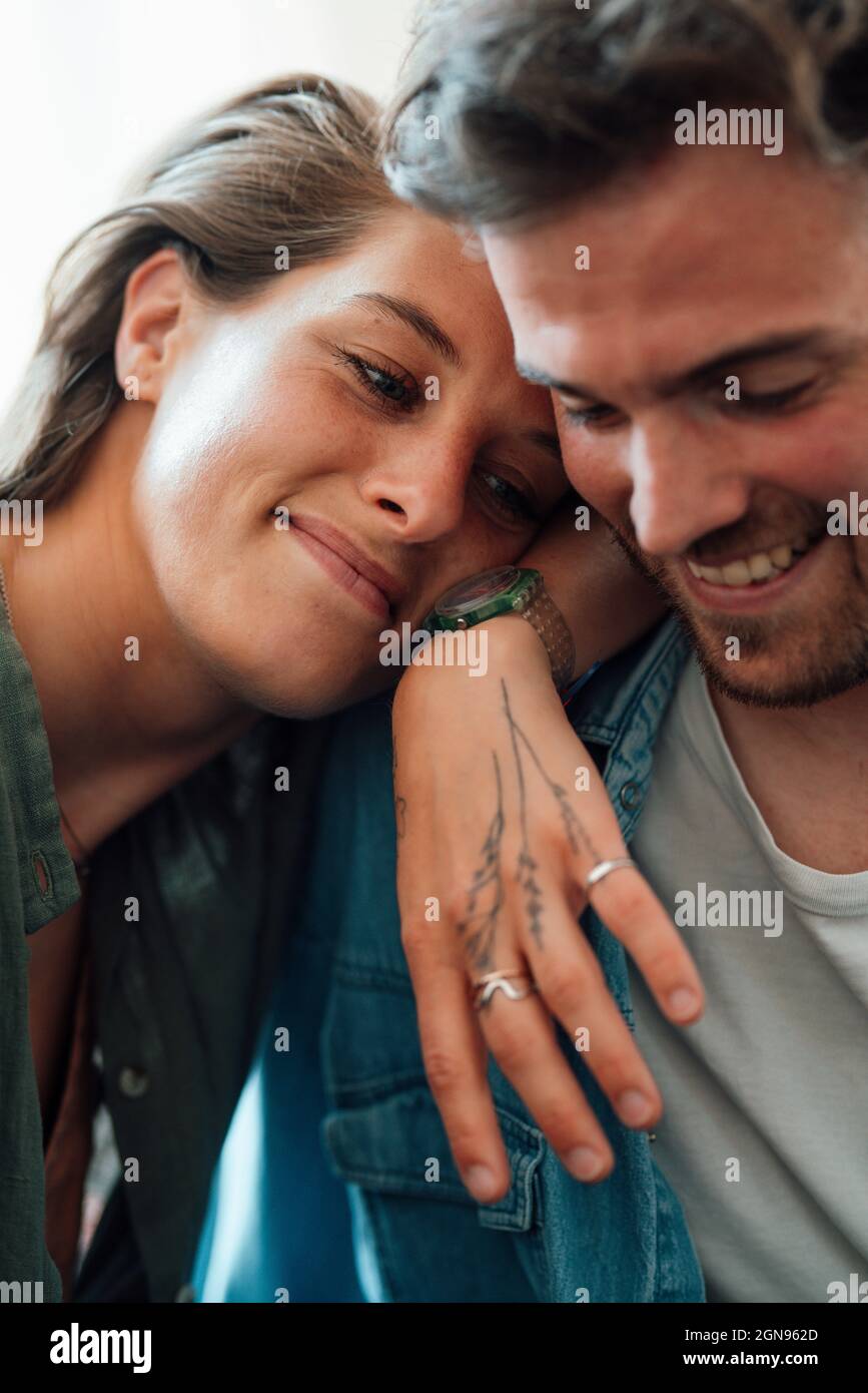 Couple using digital tablet at home Stock Photo