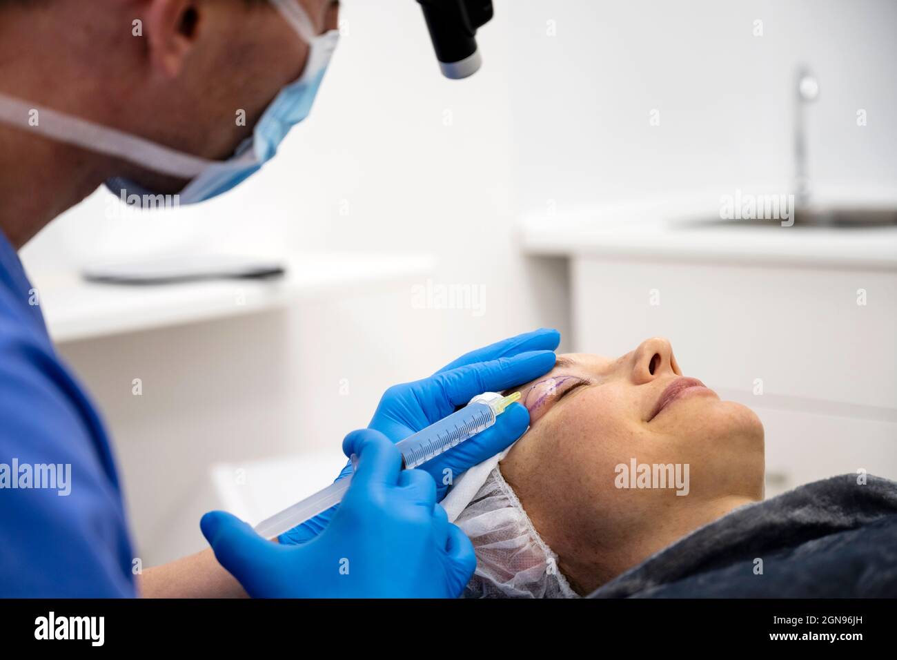 Surgeon process of blepharoplasty surgery.Apply anesthesia in eyelid