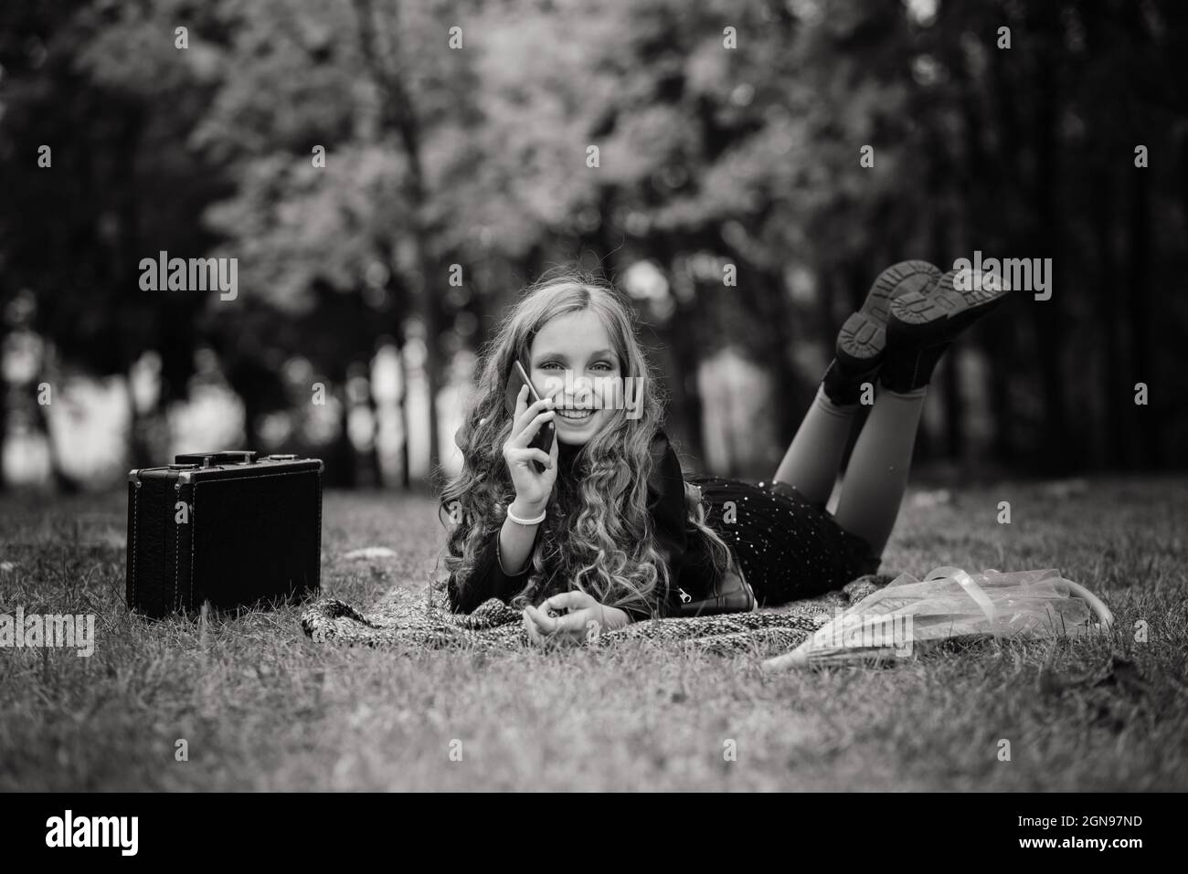Adorable little girl with autumn leaves in beauty park Stock Photo - Alamy