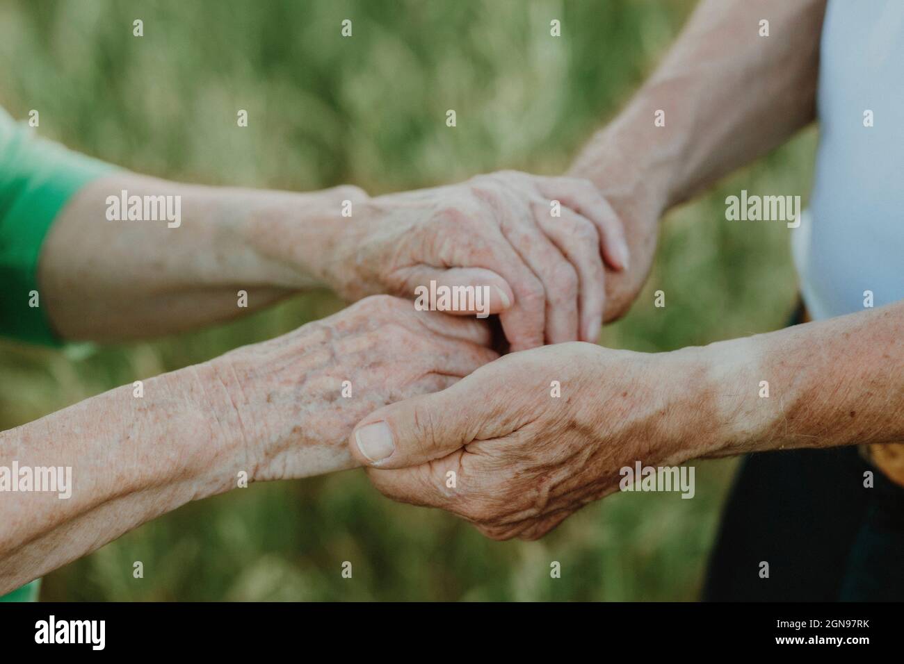 Senior couple holding hands Stock Photo
