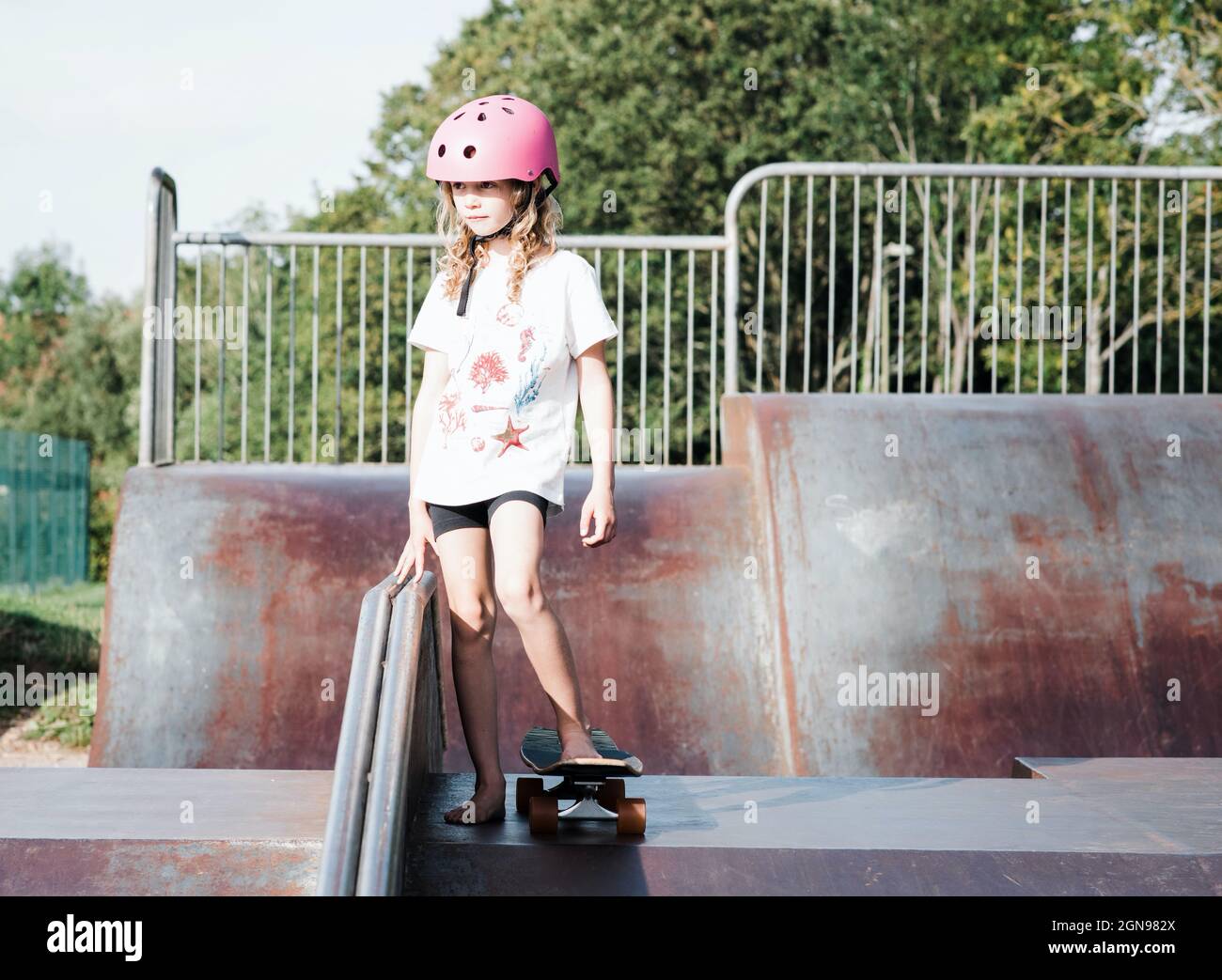 young girl skateboarding at an urban skatepark Stock Photo Alamy