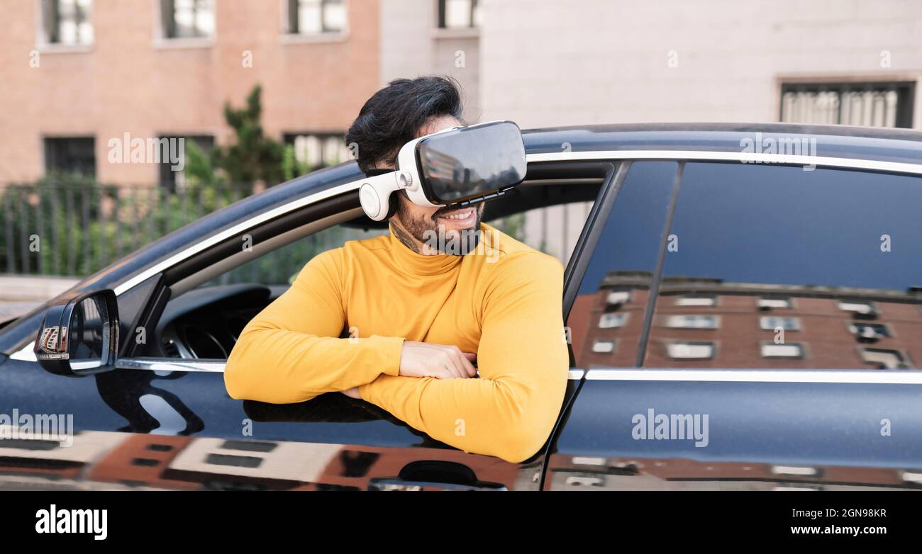 Man using virtual reality headset while sitting in car Stock Photo Alamy