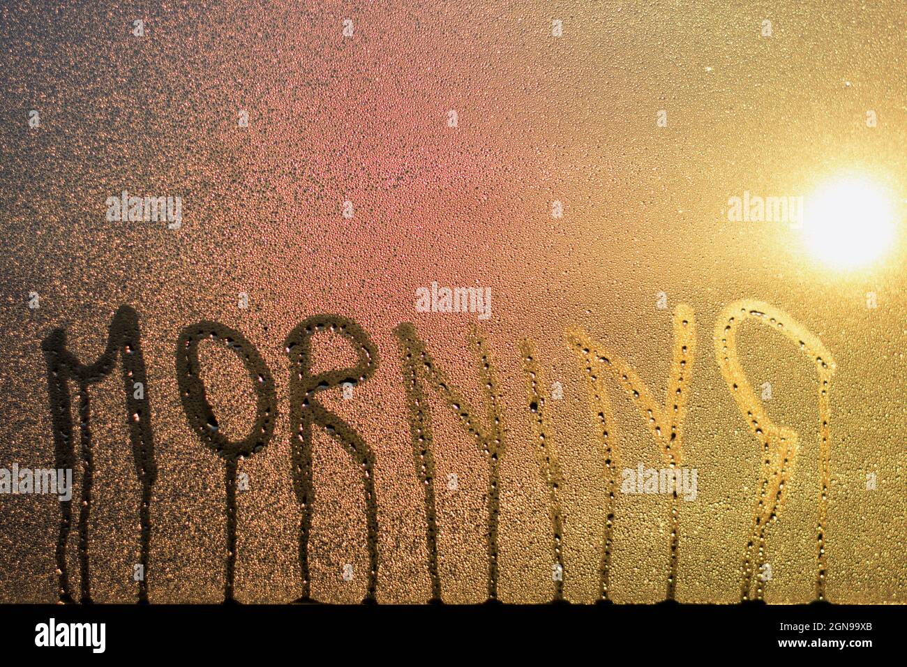 Closeup shot of morning word on the wet condensation glass window Stock ...