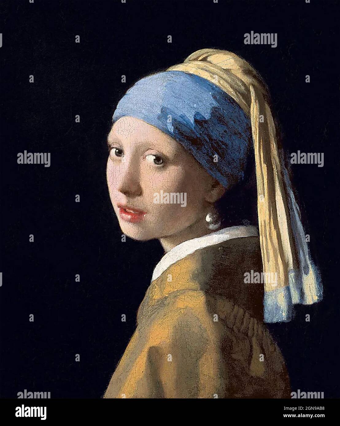 GIRL WITH A PEARL EARRING painted about 1665 by Dutch artist Johannes Vermeer (1632-1675) held in the Mauritshuis, The Hague, Holland. Stock Photo