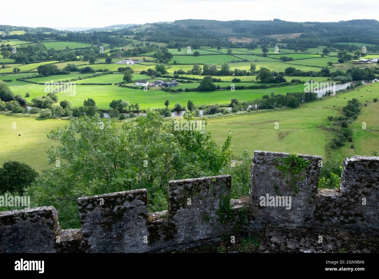 View looking out west over farming landscape farm land from stone walls of Dinefwr Castle in summer Carmarthenshire Dyfed Wales UK  KATHY DEWITT Stock Photo