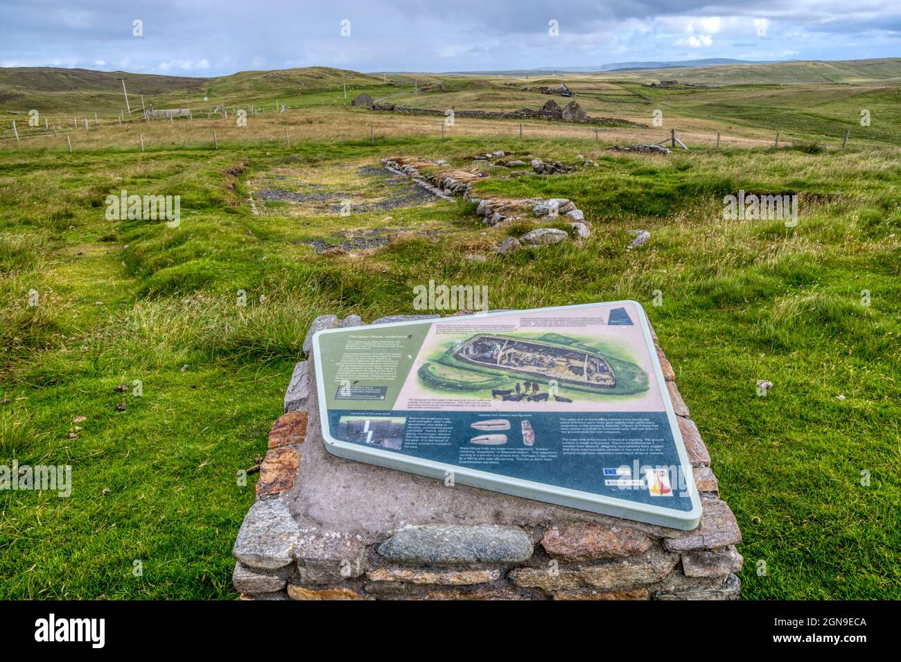Excavated remains of the Upper House at Underhoull on Unst, a Viking longhouse dating from the 11th century. With tourist information in foreground. Stock Photo