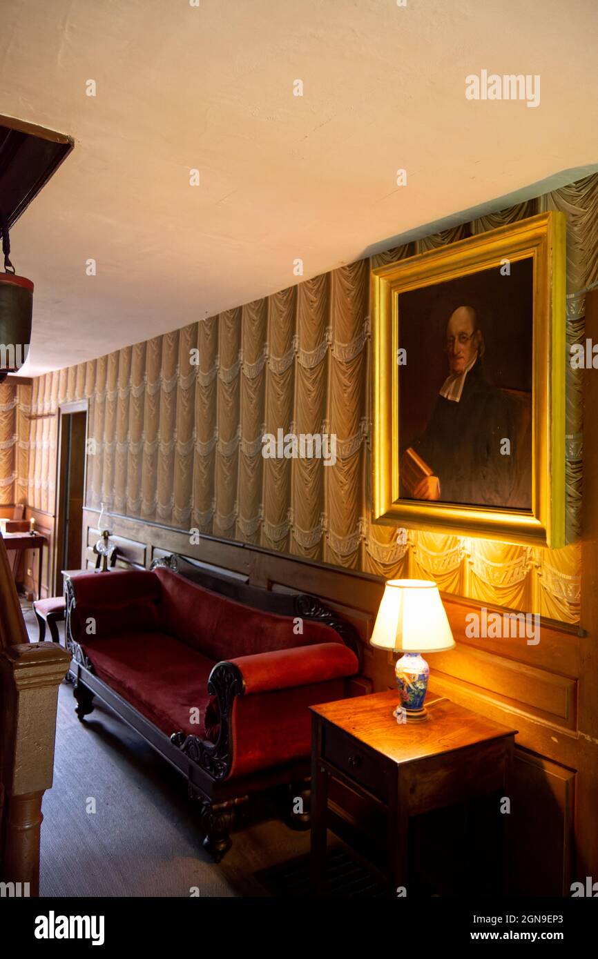 Hallway displaying wallpaper that simulates cloth curtains surrounding the walls - the historic Old Manse house on a sunny day - Concord, MA USA Stock Photo