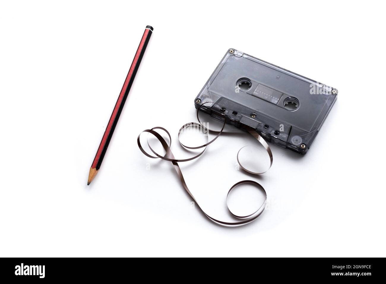 Cassette tape and pencil for winding tape Stock Photo Alamy