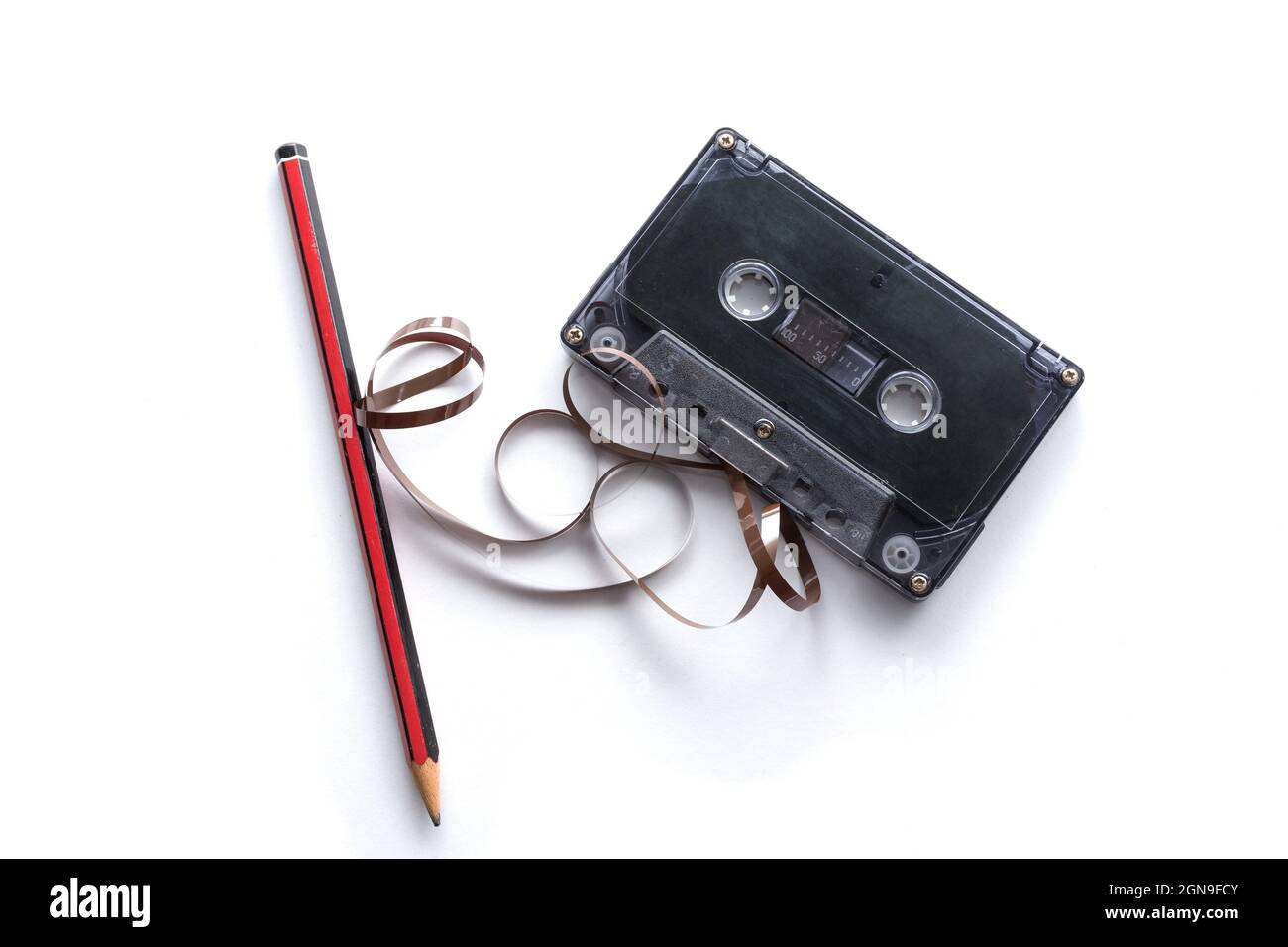 Cassette tape and pencil for winding tape Stock Photo Alamy