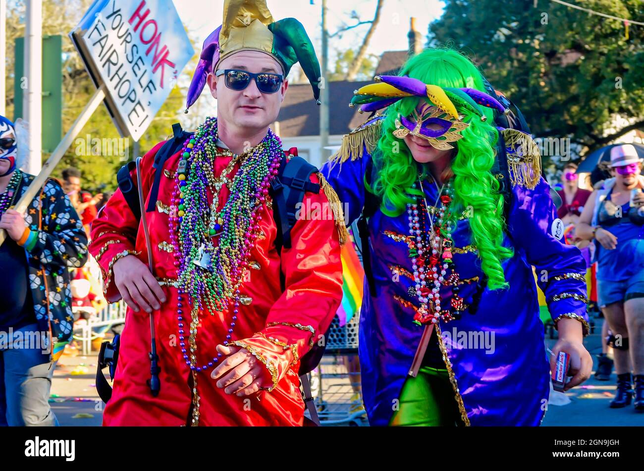 Mardi Gras revelers march during the Joe Cain Day Mardi Gras parade