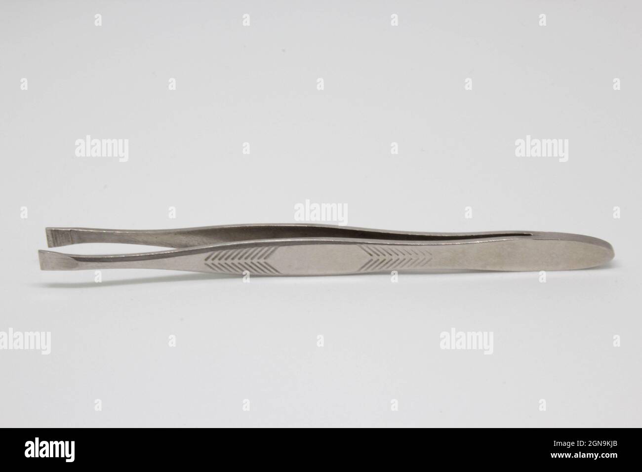 Tweezer (Thumb forceps) in different compositions and directions. Hair